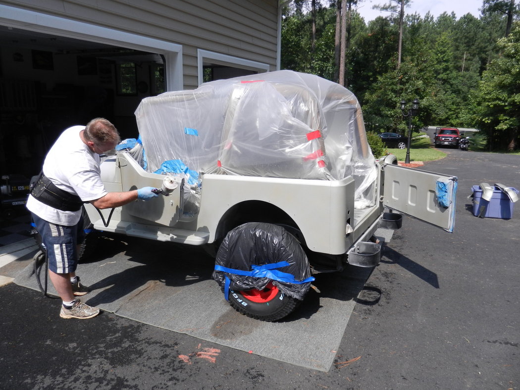 My dad painting the jeep.